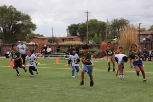Kids playing flag football.
